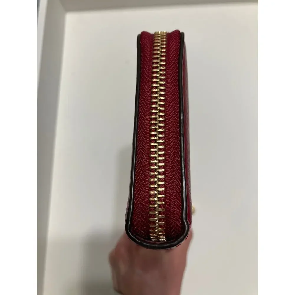 MICHAEL KORS, LARGE RED PEBBLED LEATHER WALLET